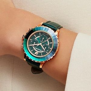 Swarovski Green and Rose Gold Octea Lux Chrono watch
Leather strap